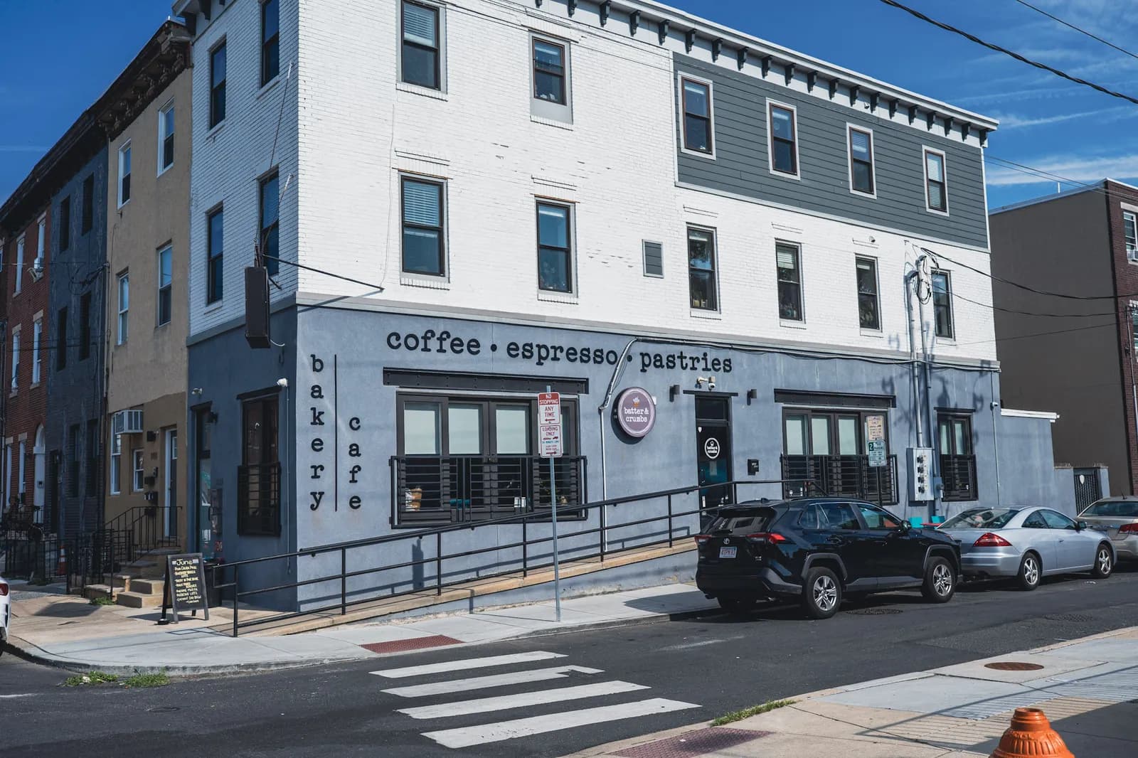 The Batter & Crumbs corner building on Reed Street, seen from across the crosswalk