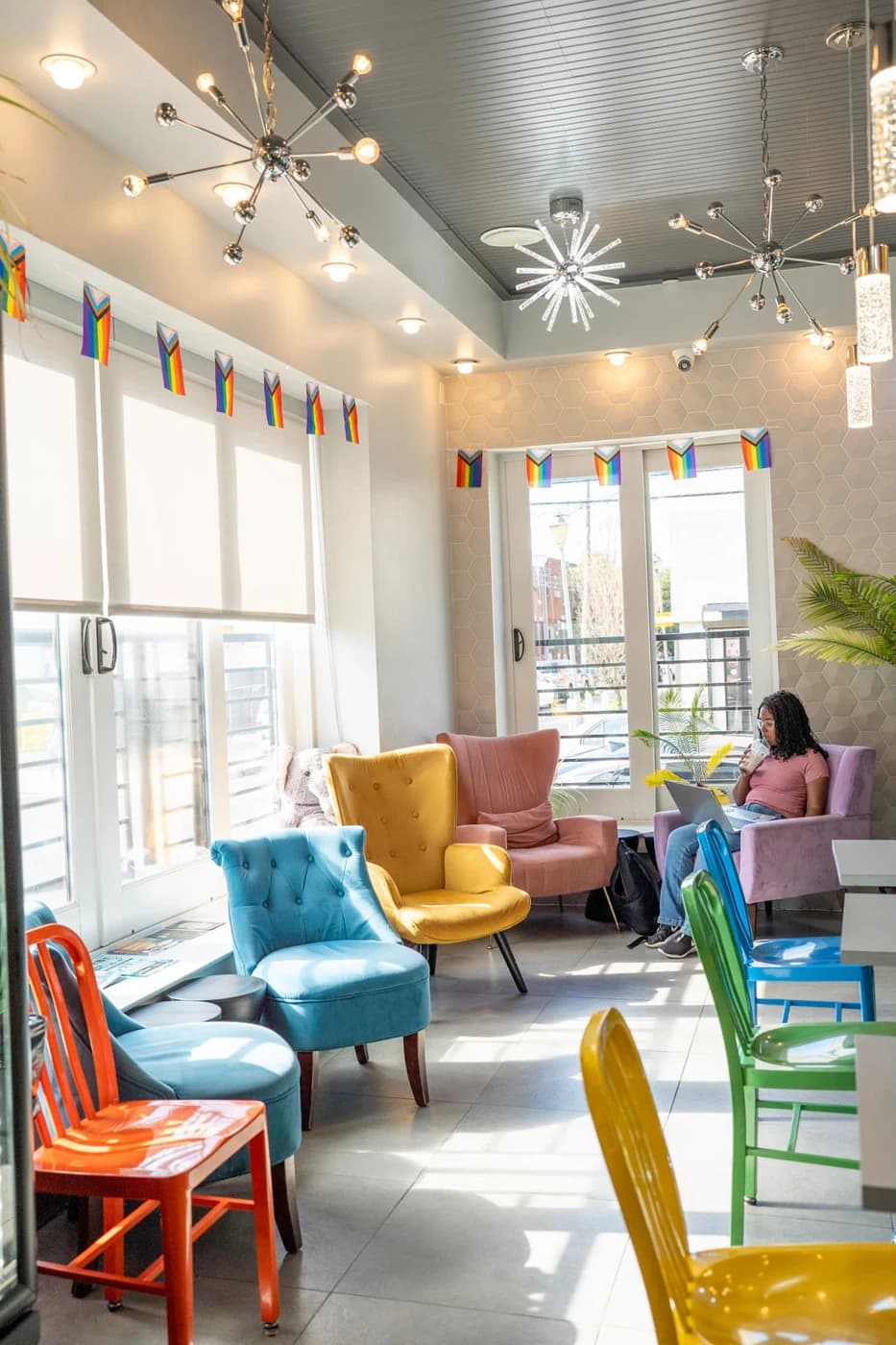 Colourful armchairs by the cafe's front windows
